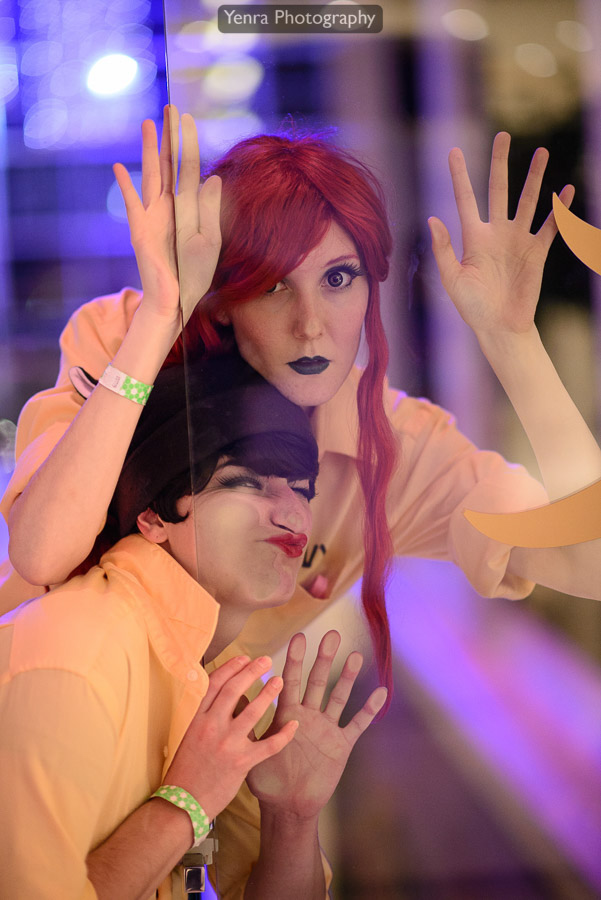 Catwoman and Poison Ivy in asylum orange tops