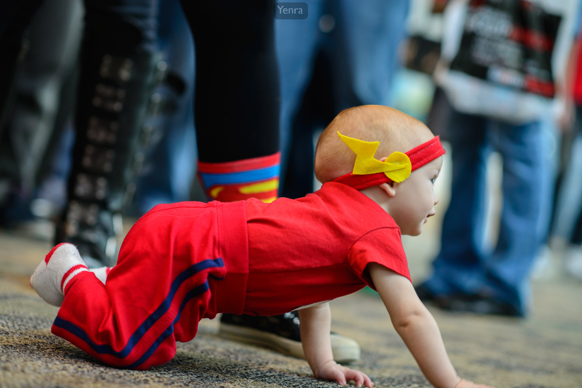 Cute baby Flash crawling  on the floor at his first con