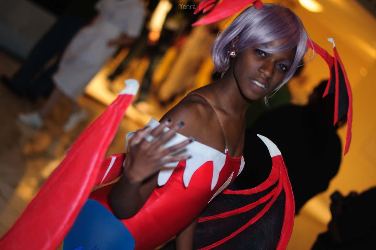 A woman dressed in a Lilith-inspired costume stands in a dimly lit room, showcasing intricate design and color schemes.