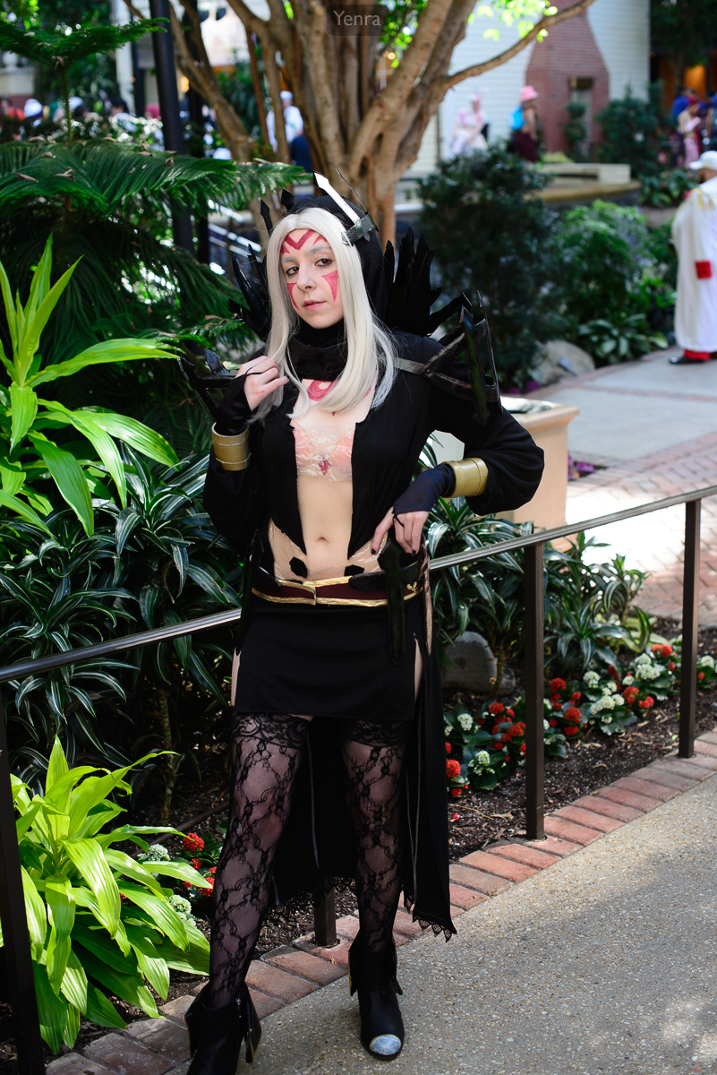 A woman dressed as Aversa from Fire Emblem: Awakening poses confidently in a convention or event setting.