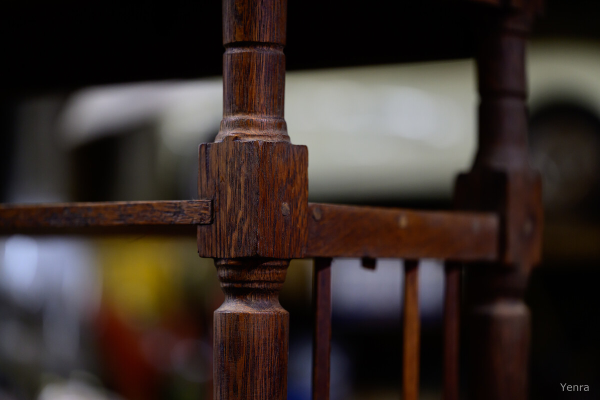 Close-up of a dark wooden furniture joint showing joinery and wood grain