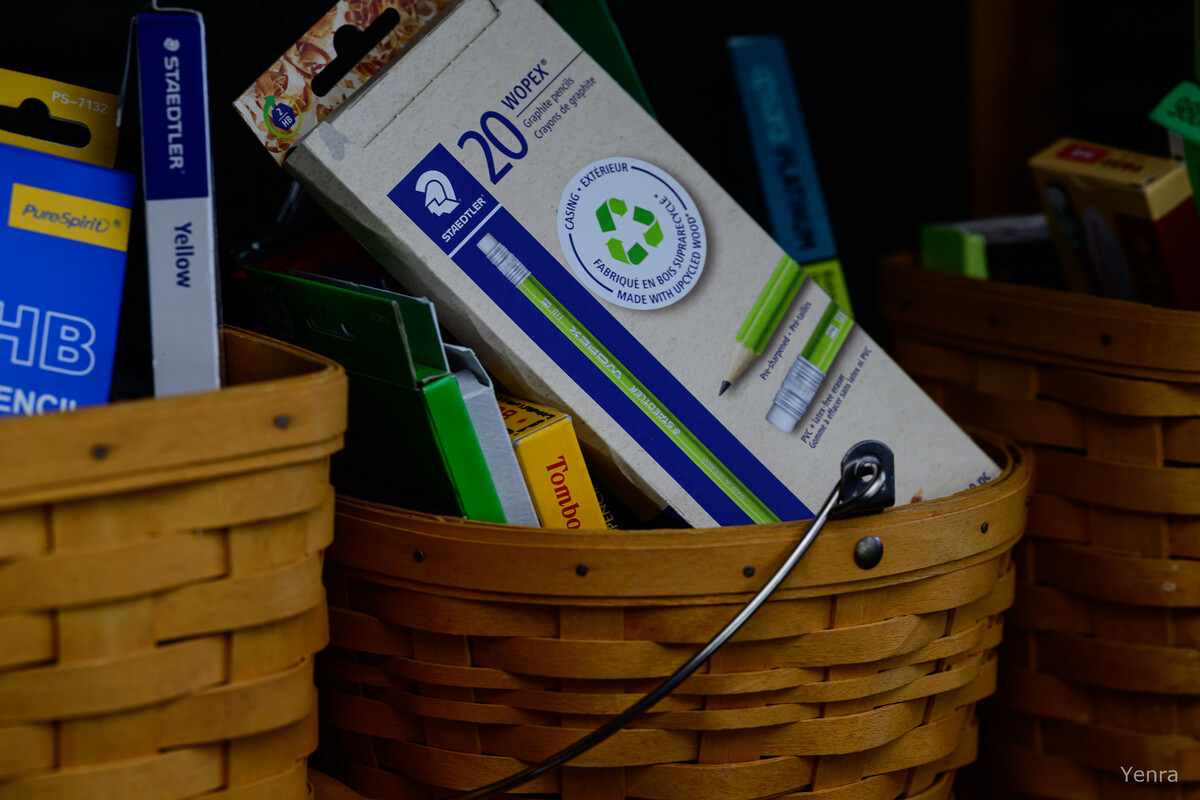 Wicker baskets containing boxed pencils and stationery supplies