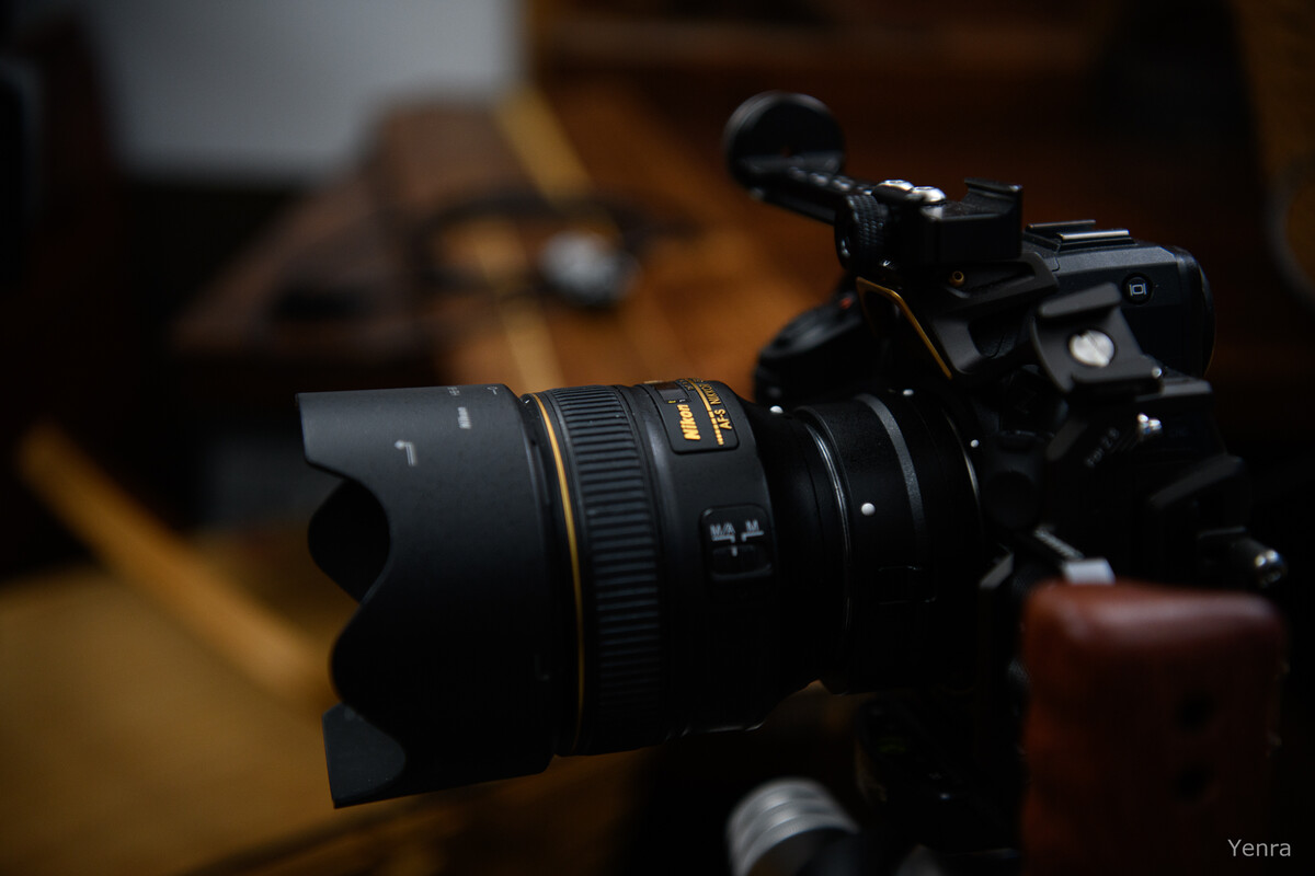 Close-up side profile of a Nikon Z8 camera with an F-mount lens and FTZ2 adapter on a rig