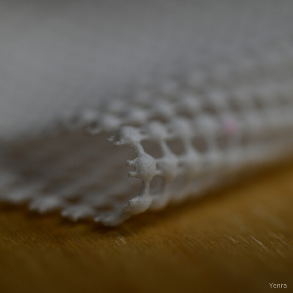 Close-up of white non-slip fabric edge on wood