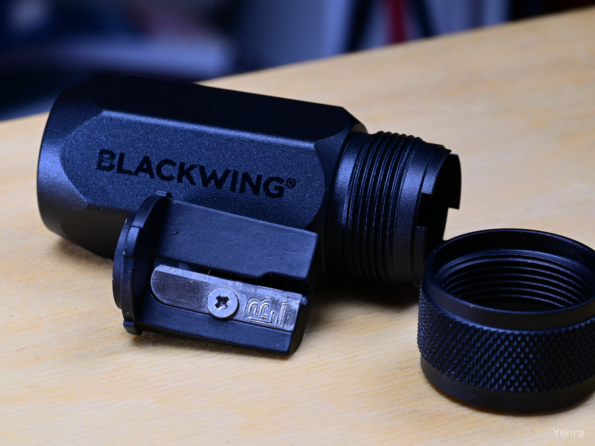 Disassembled Blackwing pencil sharpener on wooden surface